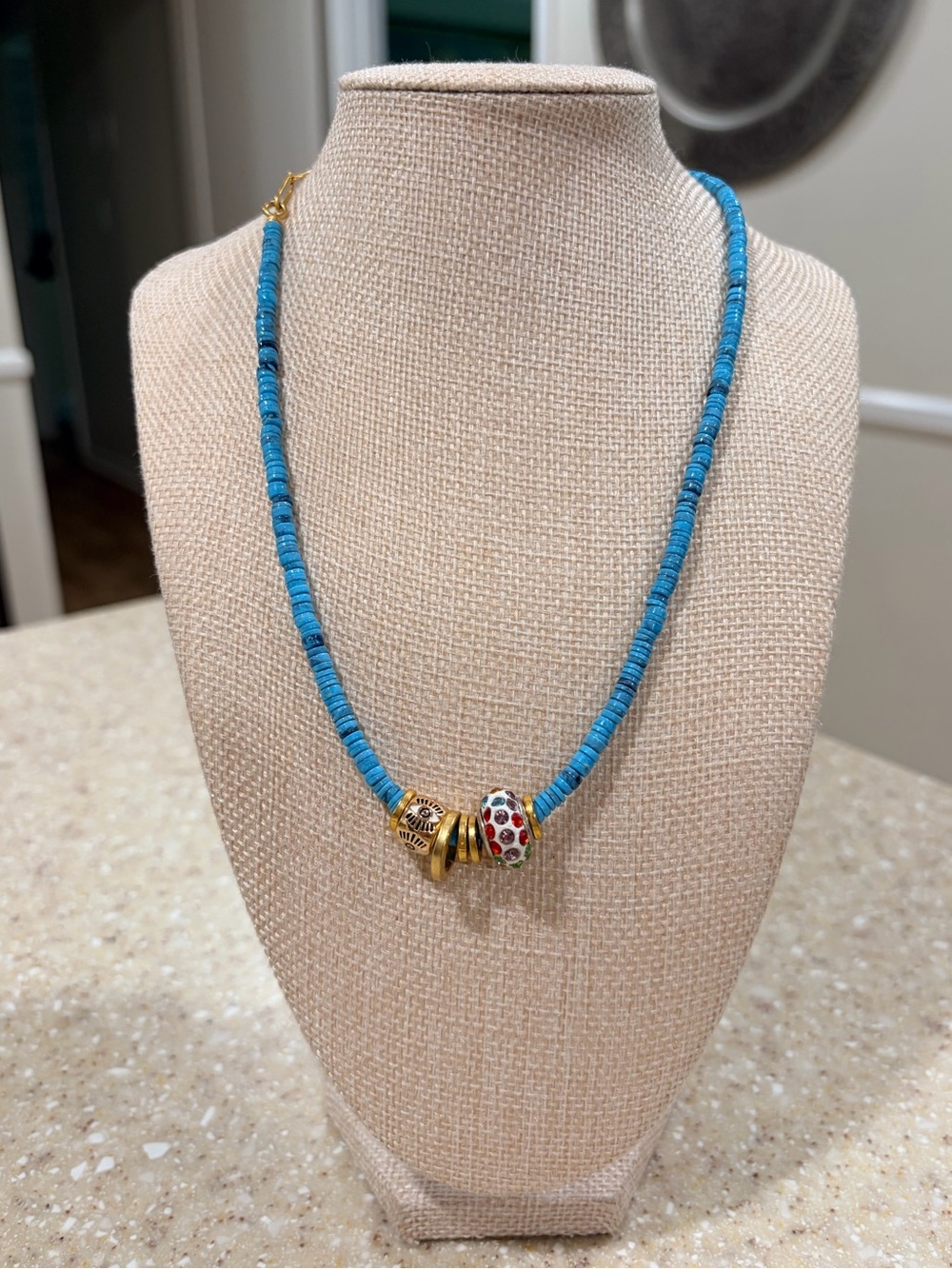 Elizabeth Cole turquoise necklace with charms